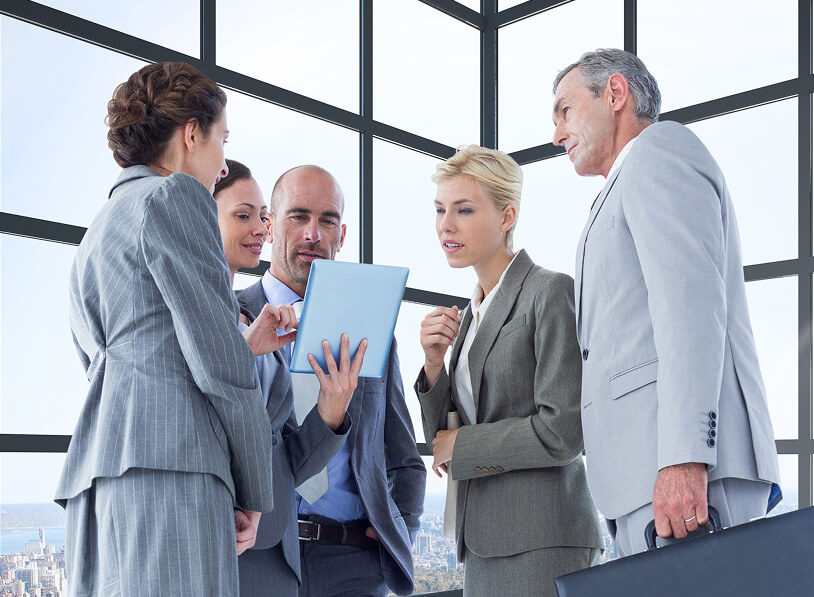 team of diverse multiethnic software developers working on computers sitting together in one